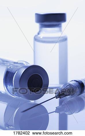 Closeup of a vial and needle View Large Photo Image Stock Image - Closeup of a vial and needle. Fotosearch