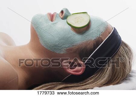 Closeup of a woman with a facial masque View Large Photo Image Stock Image - Closeup of a woman with a facial masque. Fotosearch