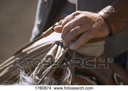 Picture - Closeup of cowboy's hand. Fotosearch