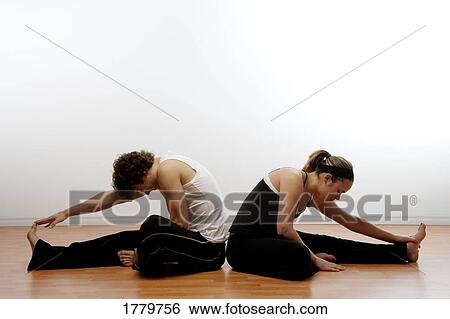 Stock Photograph - Couple doing stretches together. Fotosearch