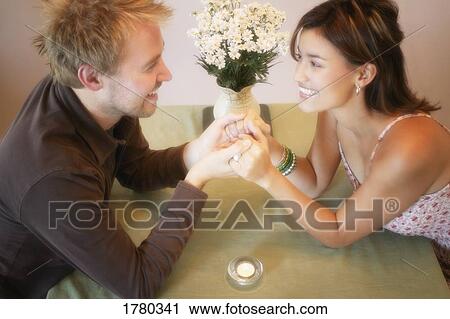 Couple holding hands View Large Photo Image Stock Image - Couple holding hands. Fotosearch