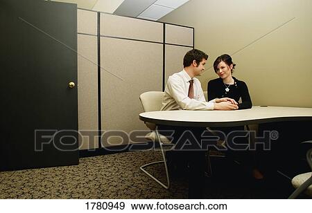 Stock Photo - Couple in the work place. Fotosearch