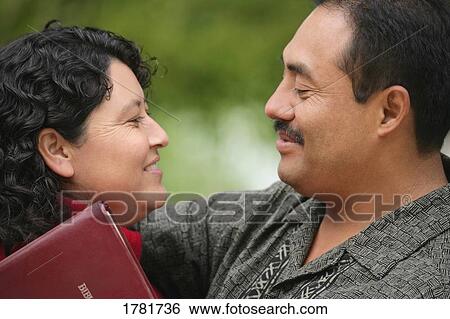 Couple looking at each other View Large Photo Image Stock Photograph - Couple looking at each other. Fotosearch
