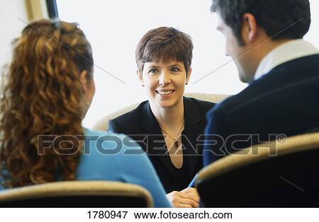 Couple meeting with woman View Large Photo Image Stock Photo - Couple meeting with woman. Fotosearch
