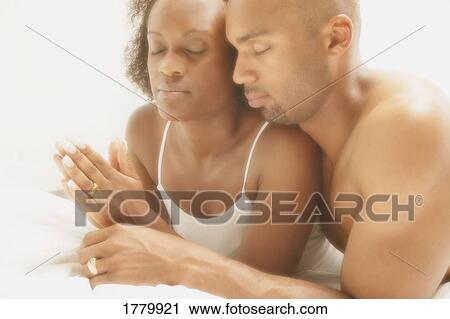 Couple pray together View Large Photo Image Stock Image - Couple pray together. Fotosearch