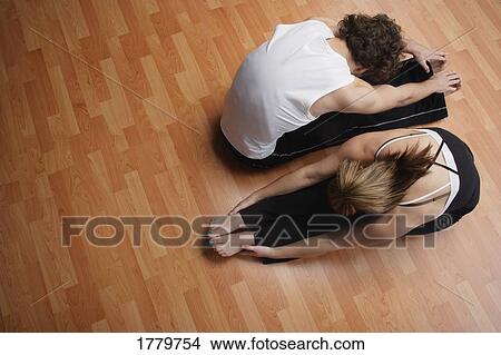 Picture - Couple stretching together. Fotosearch