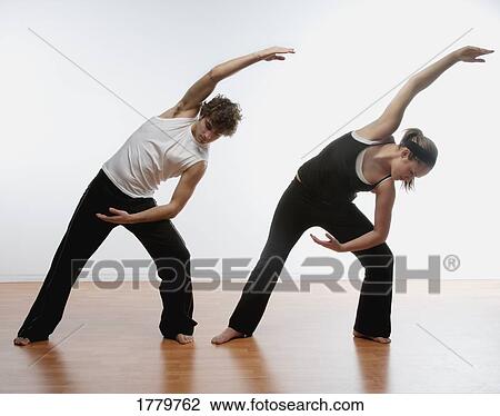Couple stretching together View Large Photo Image Stock Image - Couple stretching together. Fotosearch
