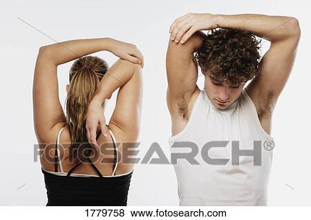 Stock Photo - Couple stretching together. Fotosearch