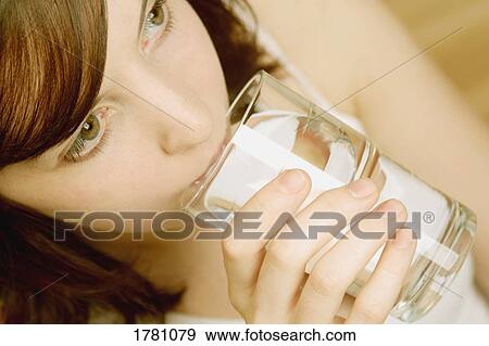 Stock Photo - Drinking a glass of water. Fotosearch