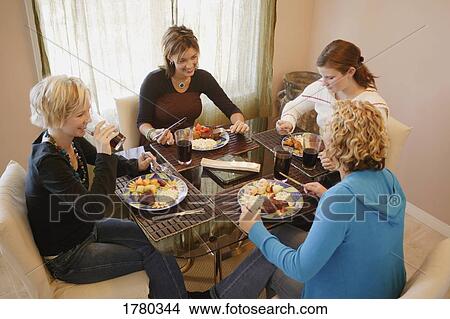 Picture - Eating a meal together. Fotosearch