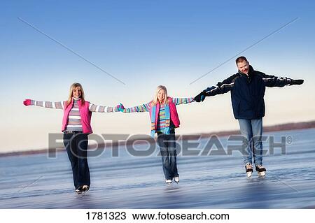Family skating together View Large Photo Image Stock Image - Family skating together. Fotosearch