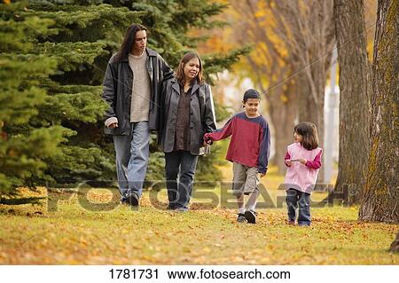 Stock Image - Family walking together. Fotosearch