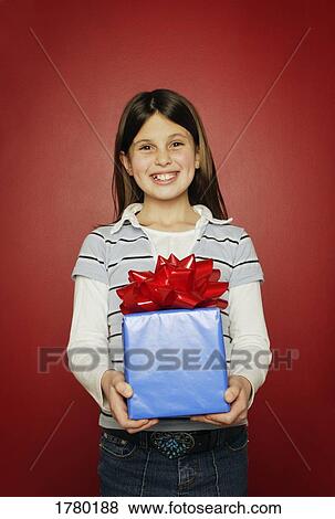 Girl with present View Large Photo Image Stock Photo - Girl with present. Fotosearch