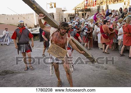 Jesus carrying the cross View Large Photo Image Stock Photo - Jesus carrying the cross. Fotosearch