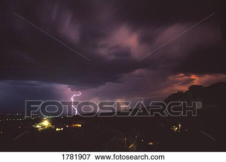 Lightening and thunderstorm over old mining town View Large Photo Image Stock Photo - Lightening and thunderstorm over old mining town. Fotosearch