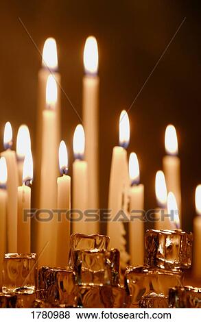 Stock Photo - Lit candles. Fotosearch