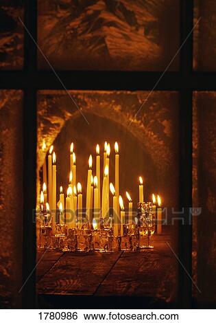 Lit candles View Large Photo Image Stock Photograph - Lit candles. Fotosearch