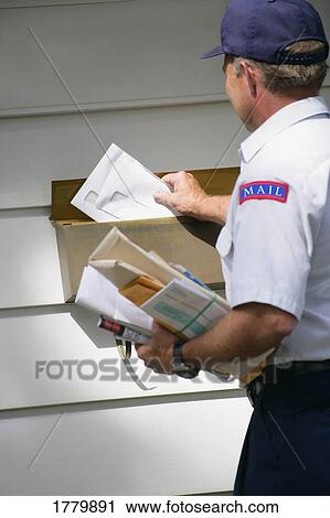 Stock Image - Mailman delivering mail. Fotosearch