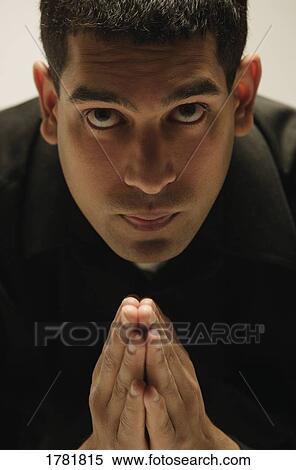 Stock Photography - Man prays. Fotosearch