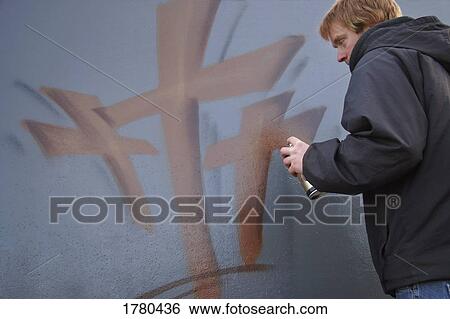 Man spray painting crosses View Large Photo Image Stock Photograph - Man spray painting crosses. Fotosearch