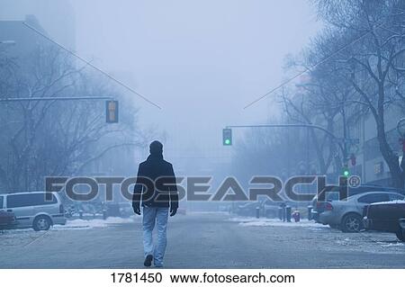 Man walking down a road View Large Photo Image Stock Image - Man walking down a road. Fotosearch