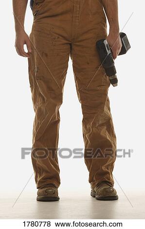 Man with a drill View Large Photo Image Stock Photo - Man with a drill. Fotosearch