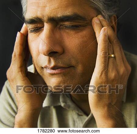 Stock Image - Man with hands on his face. Fotosearch