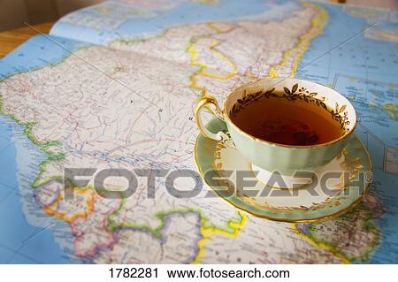 Stock Image - Map with a cup of tea. Fotosearch