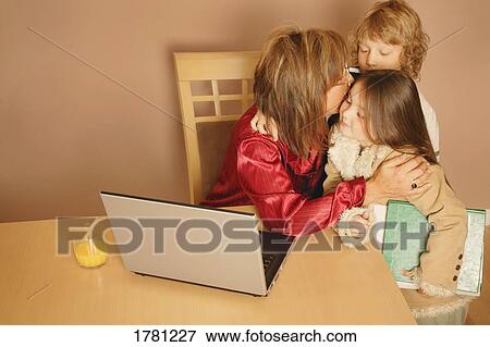 Mom says goodbye to children View Large Photo Image Stock Photo - Mom says goodbye to children. Fotosearch