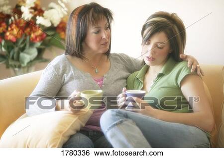 Stock Photograph - Mother helping daughter. Fotosearch