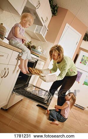 Stock Image - Mother with two small children. Fotosearch