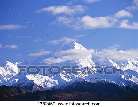 Stock Photo - Mount Brooks behind thin layer of clouds. Fotosearch
