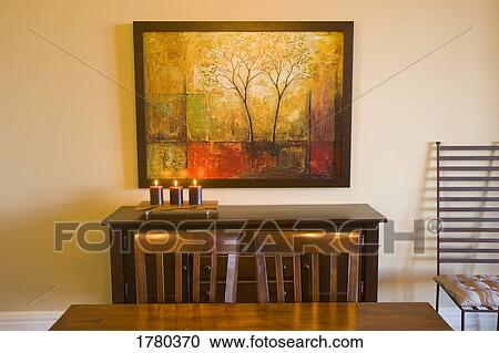 Stock Image - Painting on a wall in a dining room. Fotosearch