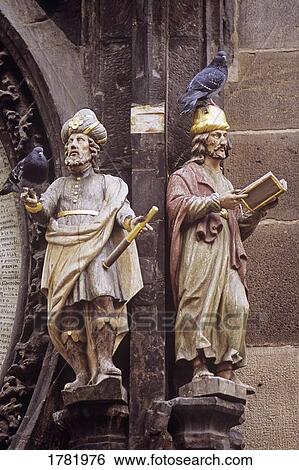 Stock Photograph - Pigeons perched on heads of figurines. Fotosearch