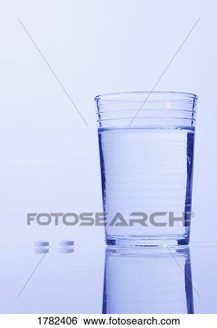 Pills and water View Large Photo Image Stock Photograph - Pills and water. Fotosearch