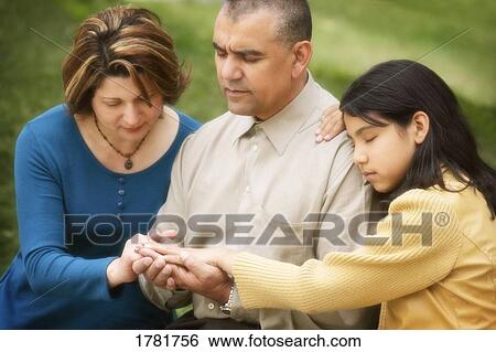 Praying together View Large Photo Image Stock Photograph - Praying together. Fotosearch