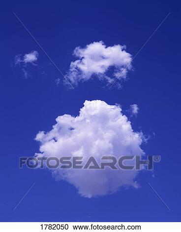 Puffy clouds in the sky View Large Photo Image Stock Image - Puffy clouds in the sky. Fotosearch