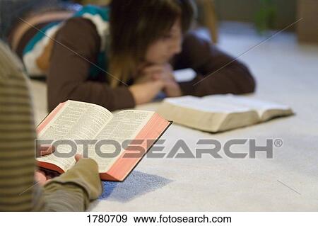 Reading the Bible View Large Photo Image Stock Photo - Reading the Bible. Fotosearch