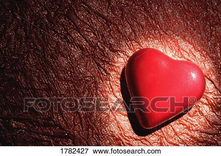 Stock Photo - Red heart on crinkle background. Fotosearch