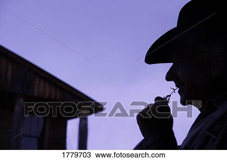 Stock Image - Silhouette of a cowboy. Fotosearch