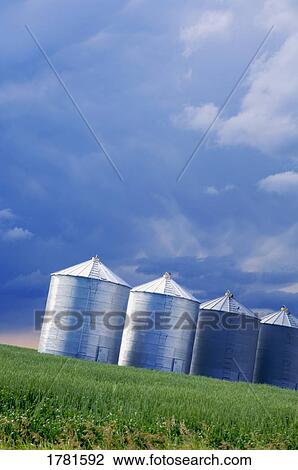 Silos in field View Large Photo Image Stock Image - Silos in field. Fotosearch
