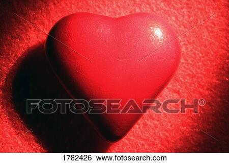 Stock Photograph - Single red heart. Fotosearch