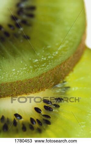 Slices of kiwi fruit View Large Photo Image Stock Image - Slices of kiwi fruit. Fotosearch