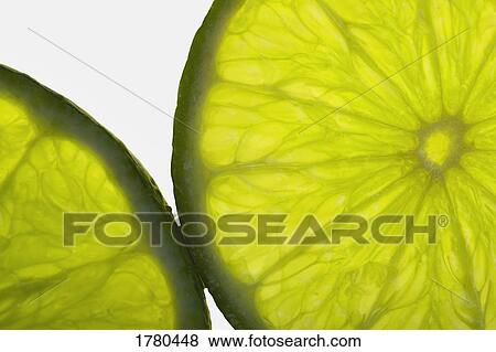 Slices of lime View Large Photo Image Stock Photo - Slices of lime. Fotosearch
