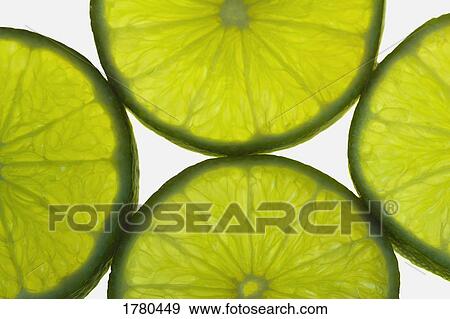 Slices of lime View Large Photo Image Stock Photo - Slices of lime. Fotosearch