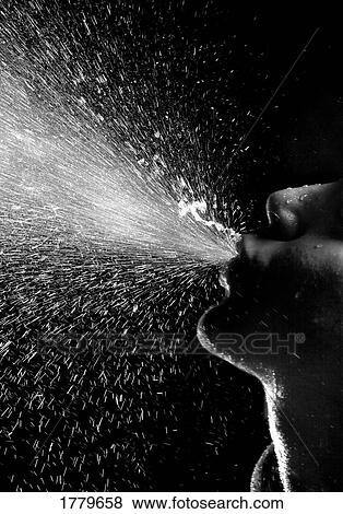 Spitting water View Large Photo Image Stock Photo - Spitting water. Fotosearch