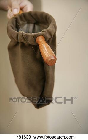 Stock Photo - Taking the offering. Fotosearch