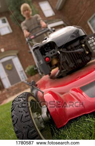 Teenage boy mowing lawn View Large Photo Image Stock Photo - Teenage boy mowing lawn. Fotosearch