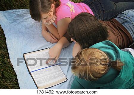 Teenagers studying the bible View Large Photo Image Stock Image - Teenagers studying the bible. Fotosearch