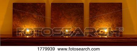 Stock Photo - Three candles. Fotosearch